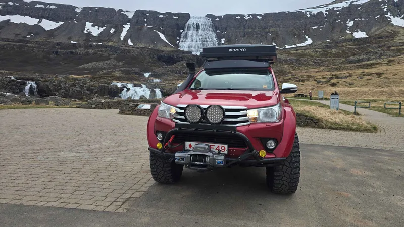 Modified superjeep on a gravel track above Arnarfjörður on the private Dynjandi waterfall superjeep tour from Ísafjörður, Westfjords, Iceland